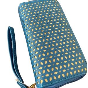 Blue wallet with wrist band never been used.